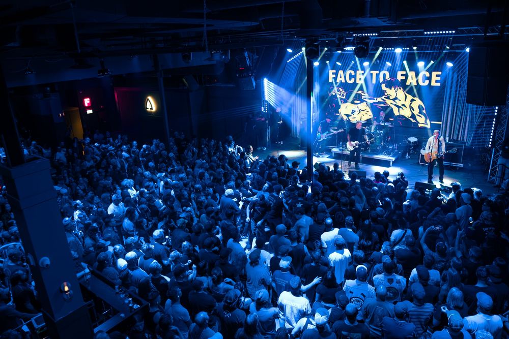 Packed crowd in blue light